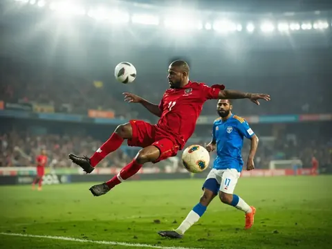 Indian football striker mid-volley inside penalty area during ISL match